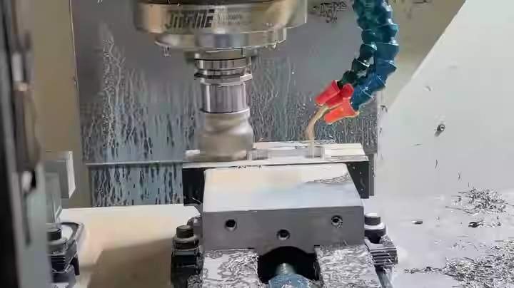 CNC milling machine machining an aluminum part