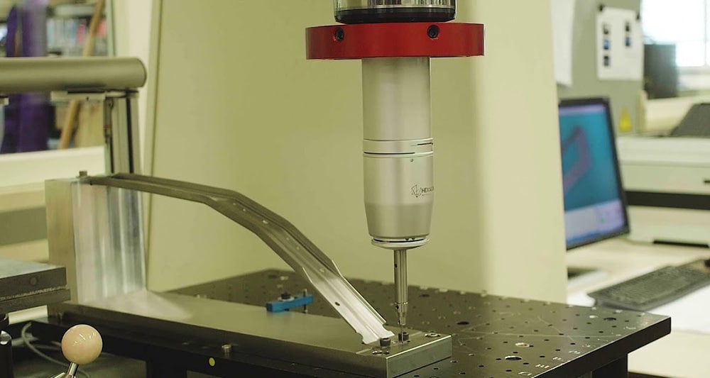 Rapzo quality inspection team performing dimensional verification and bonding checks on overmolded plastic parts