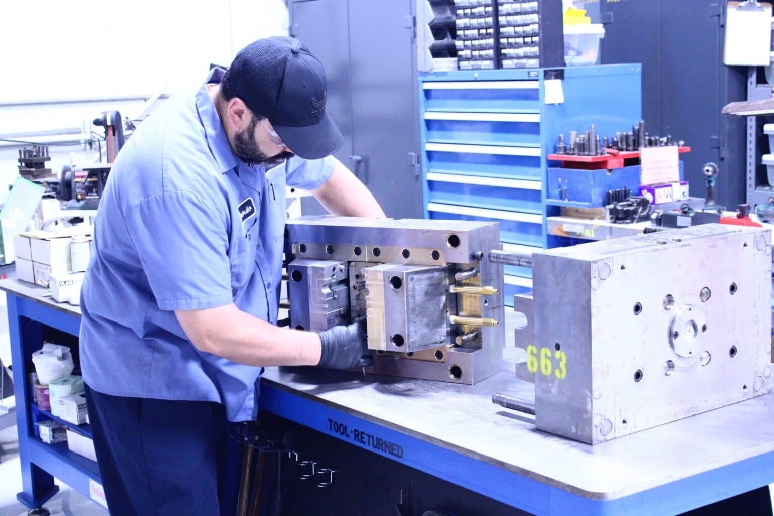 Rapzo quality inspection team performing dimensional verification on injection molded plastic parts