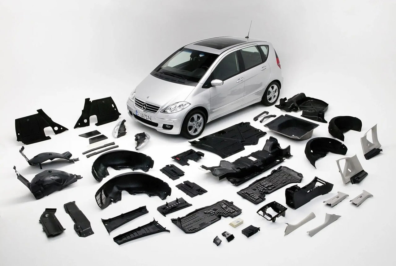 Precision injection molded automotive plastic parts for vehicle assemblies and interior components